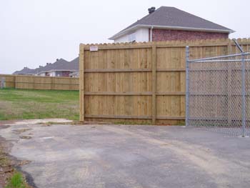 Board to Board cedar fence install, NW Arkansas